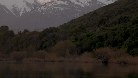 Upward panoramic view of a sunset on the calm waters of Lake Huechulafquen .. Stock Footage 290010219