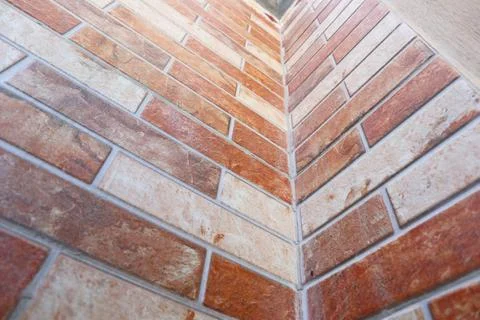 Upward perspective view of an inside corner of an orange and beige split-fa.. Stock Photos