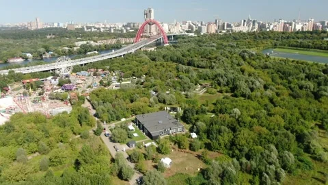 Upward rotating drone shot moving backward over green landscape Stock Footage 322528710