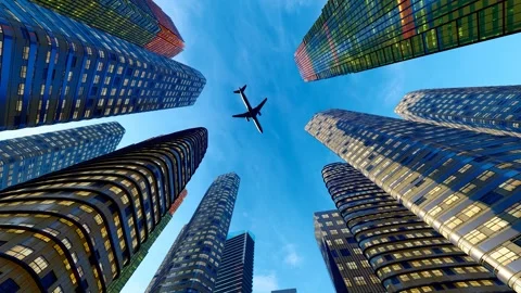 Upward shot of modern high-rise buildings and airplanes flying overhead Stock Footage 292631754