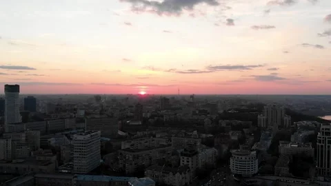 Upward sunset drone move across Kyiv evening skyline Stock Footage 331889200