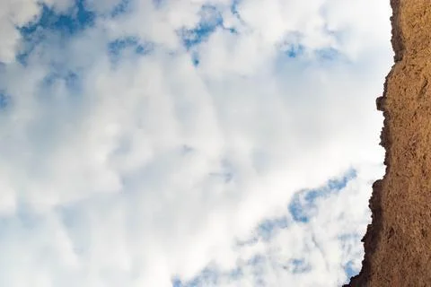 Upward view, blue sky with clouds background. Stock Photos