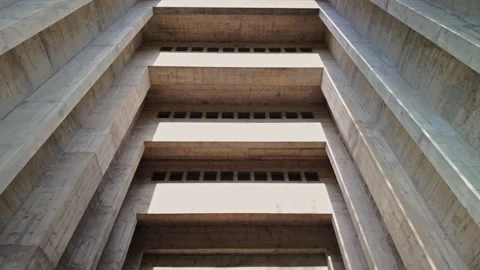 Upward view of brutalist concrete atrium with layered balconies Stock Footage 336042037