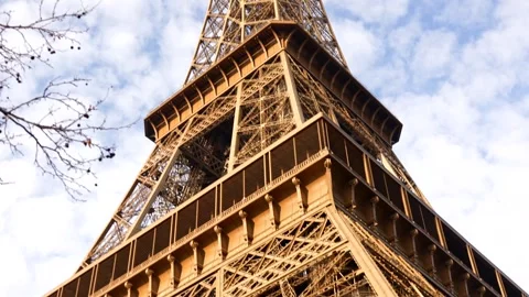 Upward view of Eiffel Tower against cloudy sky Stock Footage 314041223