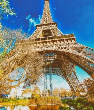 Upward view of Eiffel Tower on a beautiful sunny winter day - Pa Stock Photos