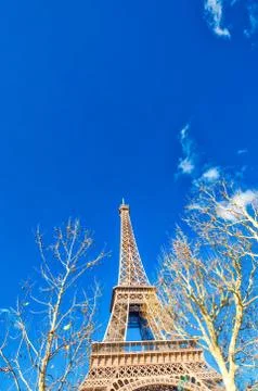 Upward view of Eiffel Tower on a beautiful sunny winter day - Paris - France Stock Photos