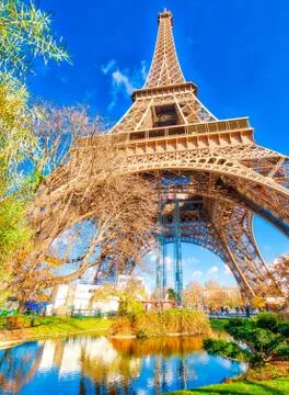 Upward view of Eiffel Tower on a beautiful sunny winter day - Pa Stock Photos