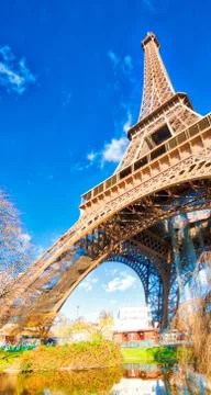 Upward view of Eiffel Tower on a beautiful sunny winter day - Paris - France Stock Photos