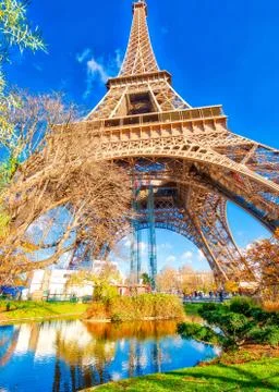 Upward view of Eiffel Tower on a beautiful sunny winter day - Pa Stock Photos