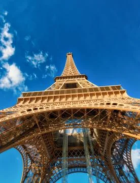 Upward view of Eiffel Tower on a beautiful sunny winter day - Paris - France Stock Photos