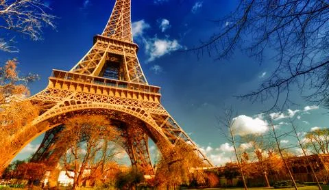 Upward view of Eiffel Tower on a beautiful sunny winter day - Pa Stock Photos