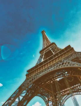 Upward view of Eiffel Tower on a beautiful sunny winter day - Paris - France Stock Photos