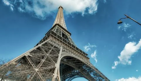 Upward view of Eiffel Tower on a beautiful sunny winter day - Paris - France Stock Photos