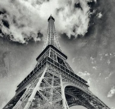Upward view of Eiffel Tower on a beautiful sunny winter day - Paris - France Stock Photos