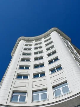 Upward view on elegant facade of white building in Madrid, Spain Stock Photos