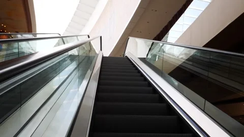 Upward View of Escalator in Modern Architectural Space Stock Footage 324393648
