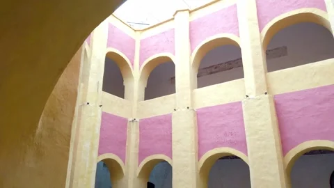 Upward View of Historic Colonial Courtyard With Elegant Arches and Colorful Stock Footage 342667732