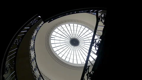 Upward view of spiral staircase with circular skylight at Somerset House, London Stock Footage 262098037