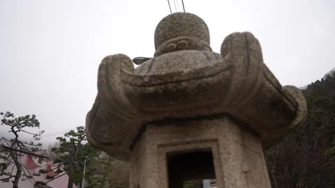 Upward view stone lantern Low Angle in Hachimangu Shrine Hakodate Japan 動画素材 324960142
