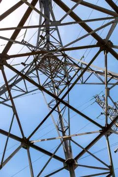 Upward view of the structure under power transmission tower Stock Photos