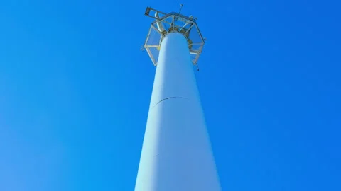 Upwards view of large moving radar with blue sky Stock Footage