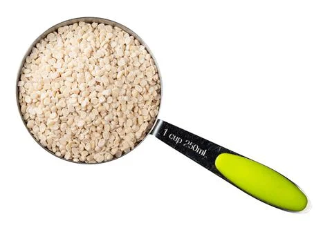 Urad dal (split black gram) beans in cup cutout Stock Photos