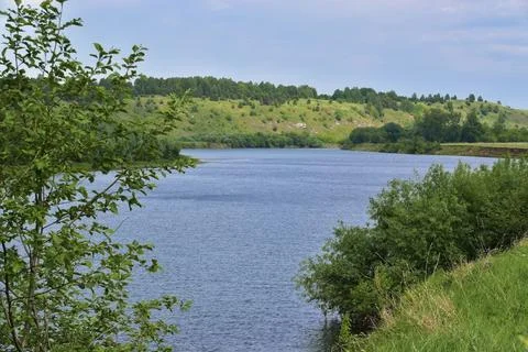 The Ural river Sylva flows under the mountain in the river valley, near the v Stock Photos
