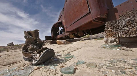 Uranium Badlands Ghost Town Relics Old Boot and Rusty Truck Stock Footage 37898895
