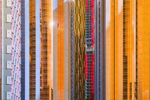 Urban abstract close up view of multiple steel and glass windows facade offic Stock Photos