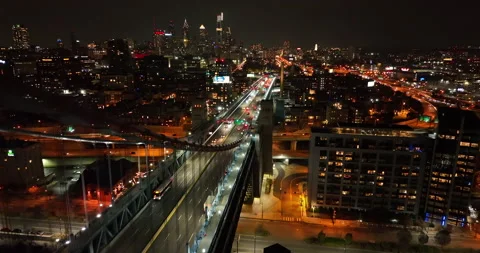 Urban American city skyline. Suspension bridge at night. Aerial flight Stock Footage 167627792