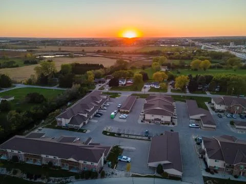 Urban apartment complex at sunset Stock Photos