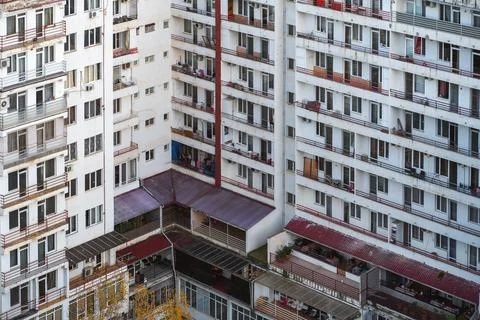 Urban architecture with the same type of residential complex with balconies and Stock Photos