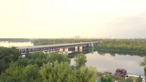 Urban Bridge over river with forest Aerial Stock Footage 114833957