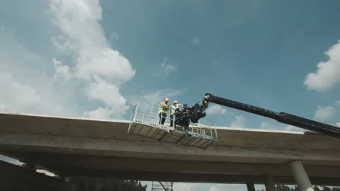 Urban building site. Construction workers planning out their project while on an Stock Footage 143563221