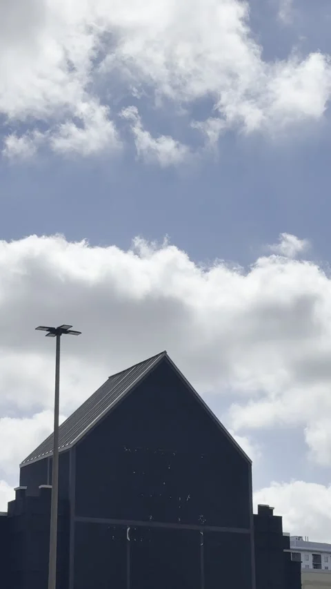 Urban Building Under Cloudy Blue Sky Stock Footage 344991242