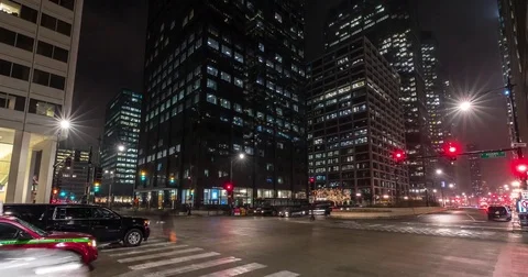 Urban city night timelapse cars traffic people walking street buildings zoom in Stock Footage