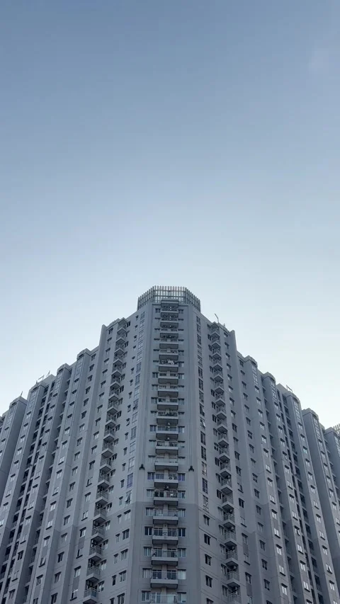 Urban cityscape featuring a modern skyscraper against jakarta skyline Stock Footage 344554327