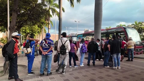 Urban Commuters Queueing for Public Bus at Bolivar Avenue in Caracas Venezuela Video stock 328293688
