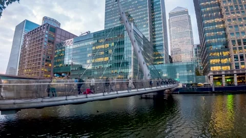 Urban concept with motion time lapse view of commuters rushing over a footbridge Video stock 310833314