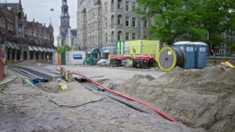 Urban construction site with large building in background, featuring cables.. Stock Footage 313495377