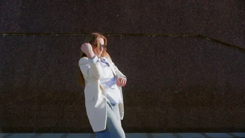 Urban contemporary dancer showcasing creative movements by a wall Stock Footage 292733357