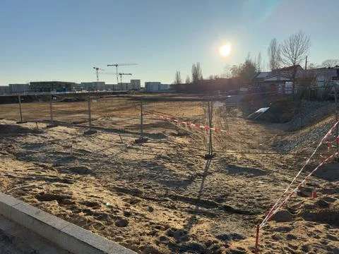 Urban development construction site with cranes building housing Stock Photos