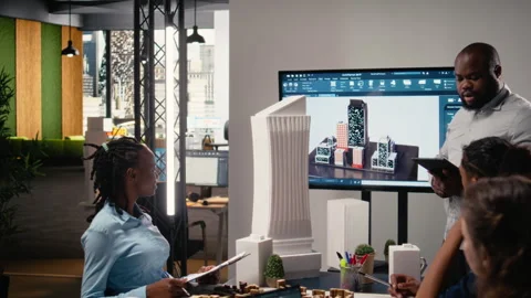 Urban development diverse team discussing property investment Stock Footage 316795950