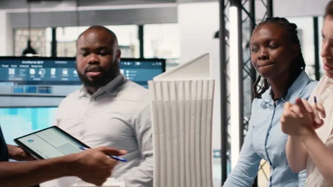 Urban development experts use teamwork to envision a new housing project Stock Footage 316643624