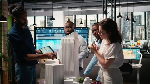 Urban development experts use teamwork to envision a new housing project Stock Footage 316649539