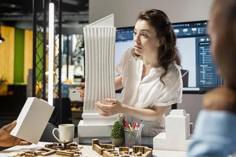 Urban development experts use teamwork to envision a new housing project Stock Photos