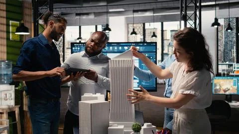 Urban development experts use teamwork to envision a new housing project Stock Photos