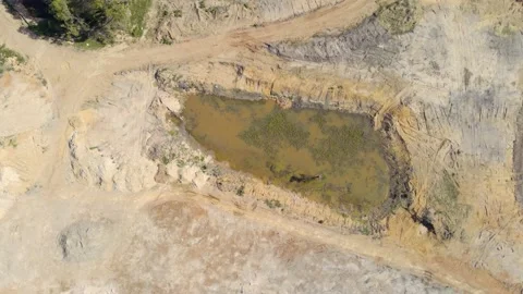 Urban Development – Left pan over muddy pond Stock Footage 146770294