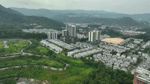 Urban Development in Nature Surrounded by Green Hills and Mountains Stock Footage 311575558