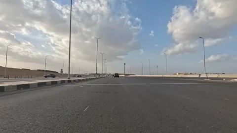 Urban Drive Along Main Boulevards New Cairo Showing Buildings Traffic Vehicles Stock-Footage 329657228